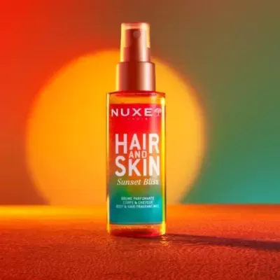 Frasco de spray NUXE HAIR AND SKIN Sunset Bliss com tampa laranja