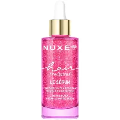 Frasco de sérum capilar rosa NUXE com conta-gotas dourado e texto branco