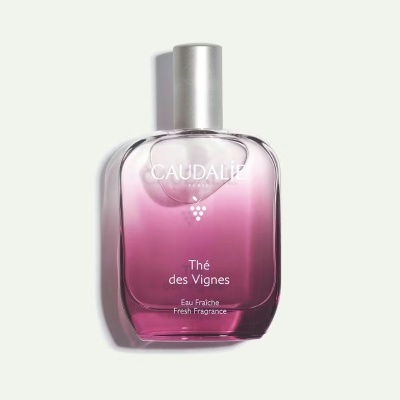 Frasco de perfume rosa degradê com tampa prateada