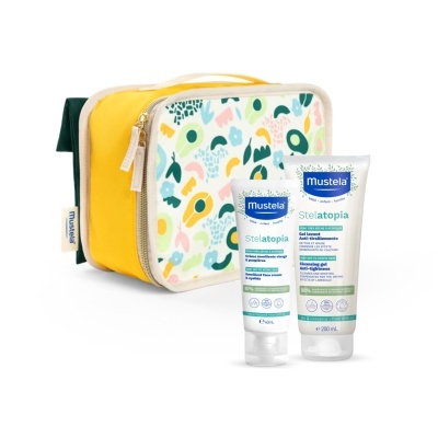 Produtos Mustela Stelatopia em tubos brancos com bolsa amarela estampada.