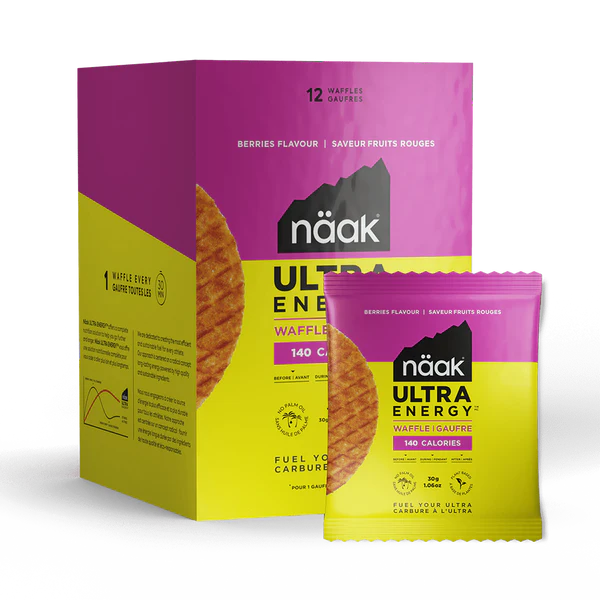Embalagem e pacote rosa e amarelo de waffles Näak Ultra Energy sabor frutos vermelhos