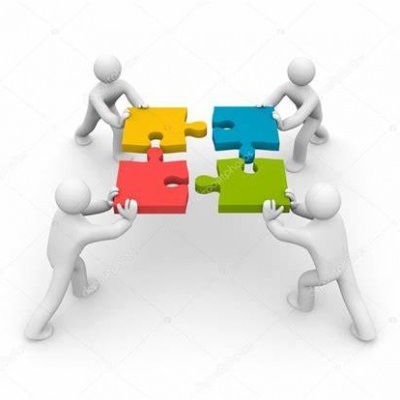 Bonecos brancos montando peças de quebra-cabeça coloridas