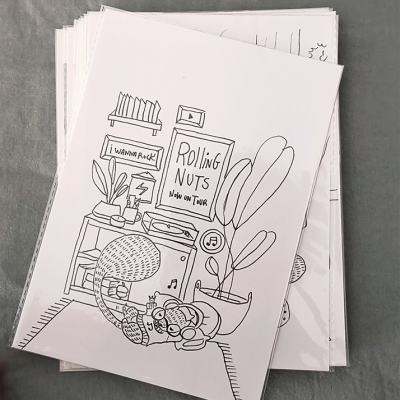 Folhas de papel com desenhos a preto e branco e texto em inglês, sobre fundo cinzento.