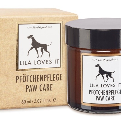 Frasco de cuidado para patas de cão com caixa correspondente.