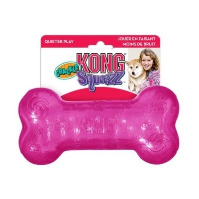 Brinquedo para cães KONG Squeezz rosa em forma de osso na embalagem