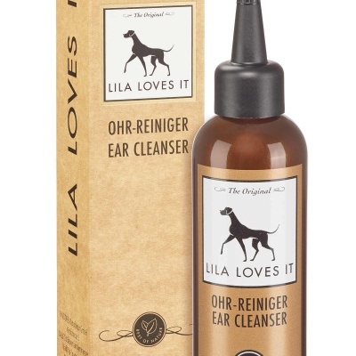 Frasco castanho com líquido e caixa castanha do produto de limpeza auricular para cães
