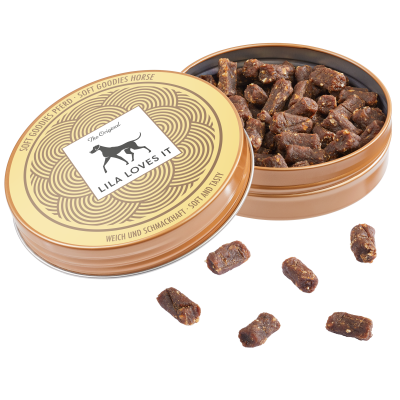 Embalagem redonda metálica com petiscos para cães e texto na tampa