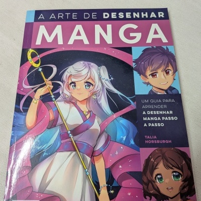 Capa do livro A Arte de Desenhar Manga com personagem manga feminina e texto de título.