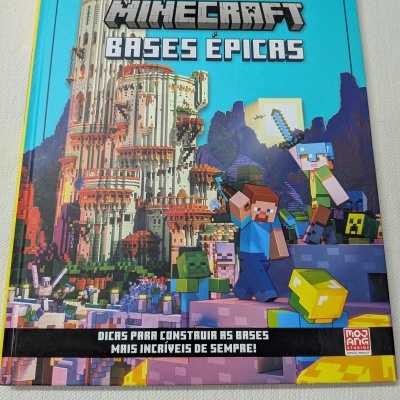 Livro Minecraft Bases Épicas com personagens e construção pixelizada na capa