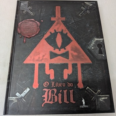 Livro preto com figura triangular vermelha e título O Livro do Bill em capa texturada.