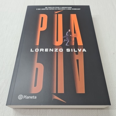 Capa do livro PUA de Lorenzo Silva com fundo preto e letras laranja e brancas