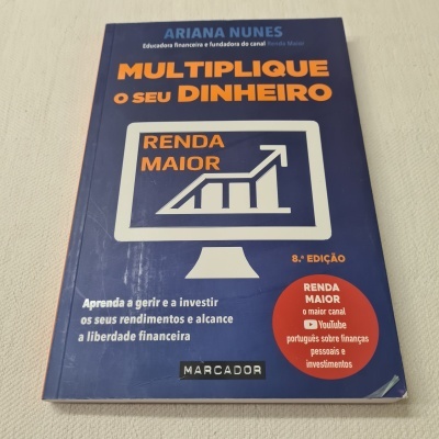 Livro 'Multiplique o seu dinheiro' com capa azul e texto laranja e branco