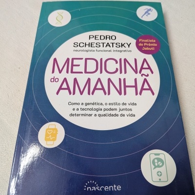 Capa de livro Medicina do Amanhã com fundo azul e Ícones