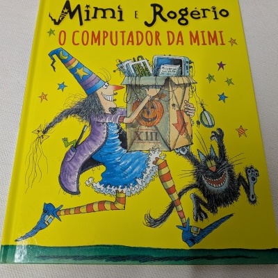 Livro infantil Mimi e Rogério com ilustração de bruxa e gato e título em amarelo