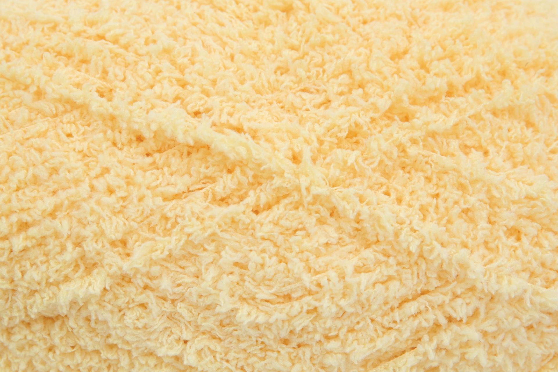 Textura felpuda de malha de fio amarelo claro entrelaçado