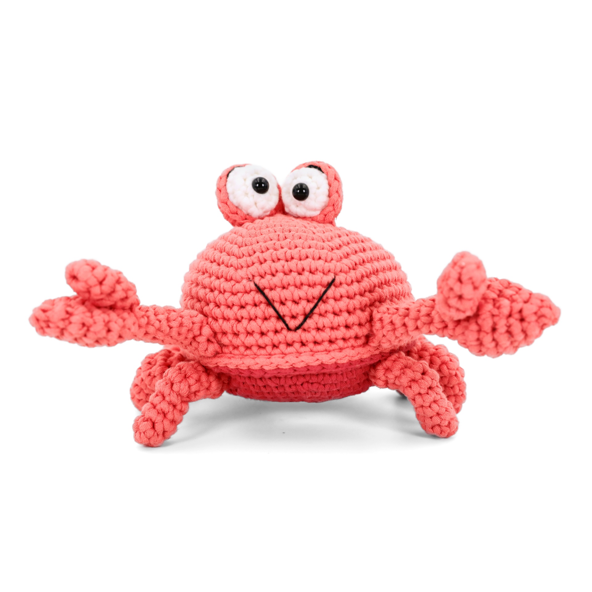 Brinquedo de croché caranguejo cor-de-rosa com olhos grandes
