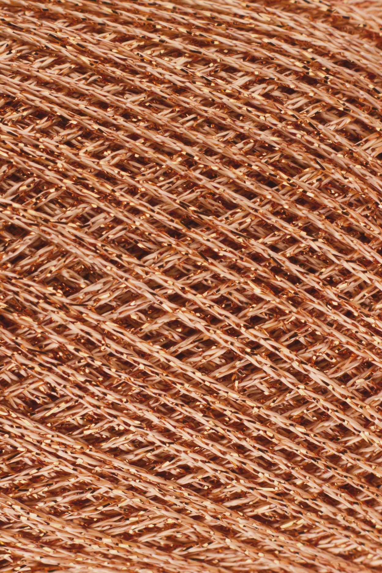 Trama têxtil metálica cor cobre brilhante entrelaçada