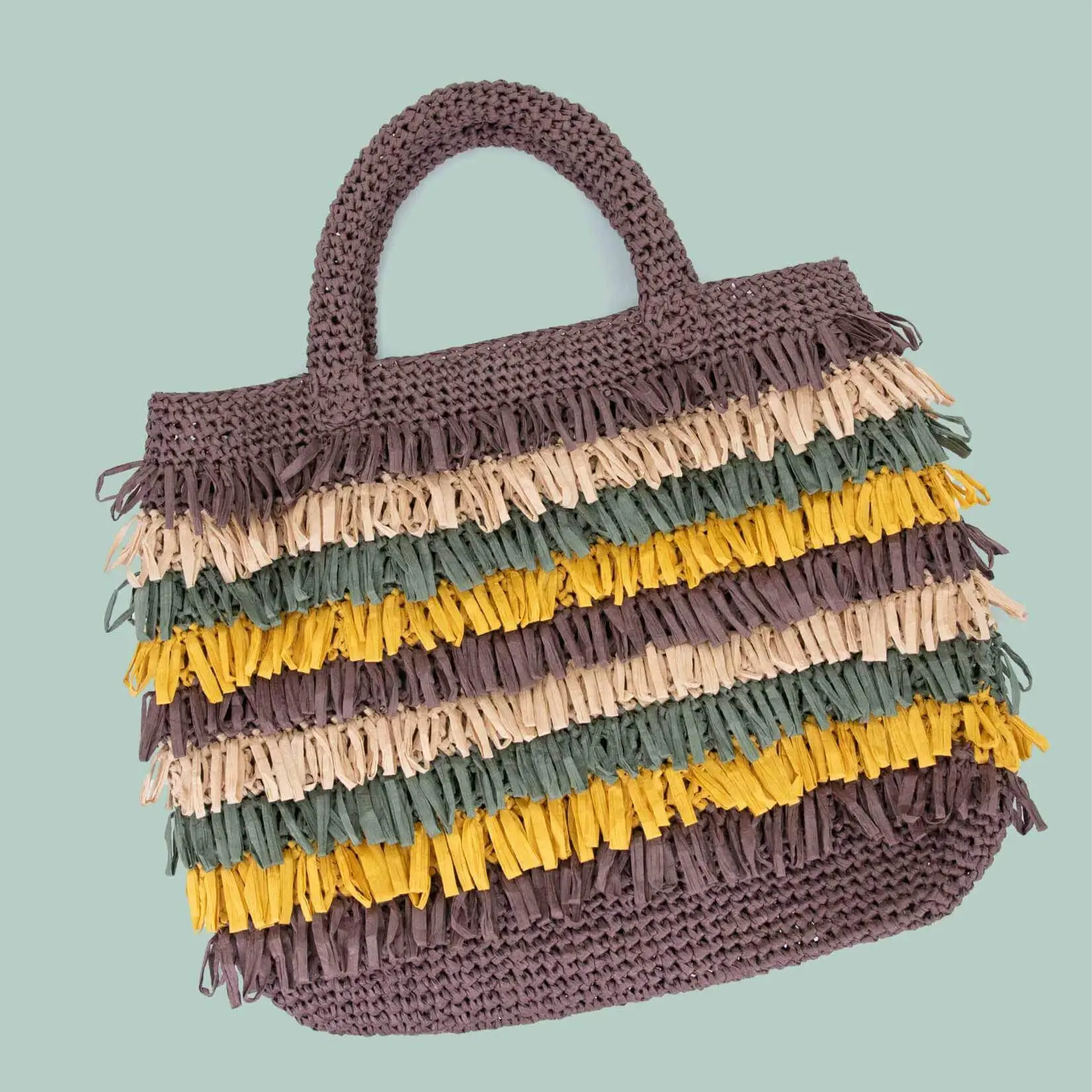 Mala tricotada com franjas coloridas
