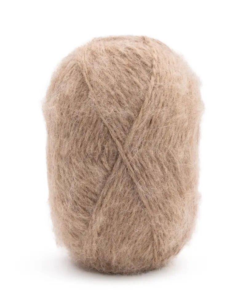 Novelo de lã bege felpuda com textura macia