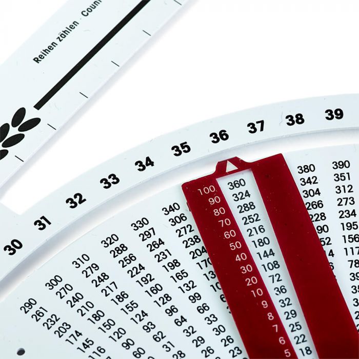 Dispositivo analógico de contagem circular com escala numérica e indicador vermelho