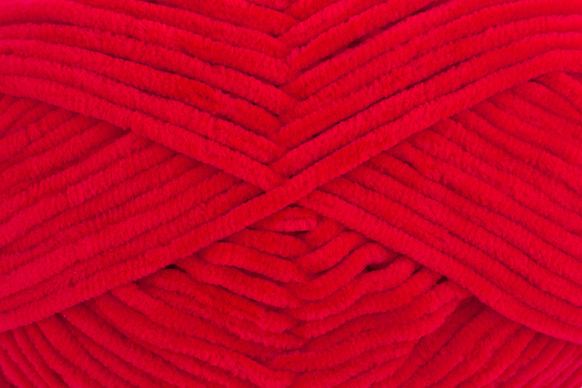 Fio de lã vermelho com textura felpuda e nervurada