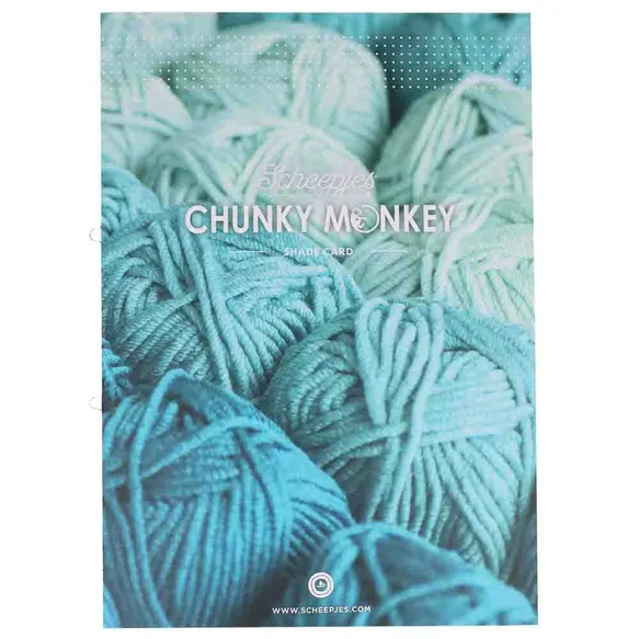 Catálogo de lã grossa com várias bolas de fio azul e cinza enroladas.