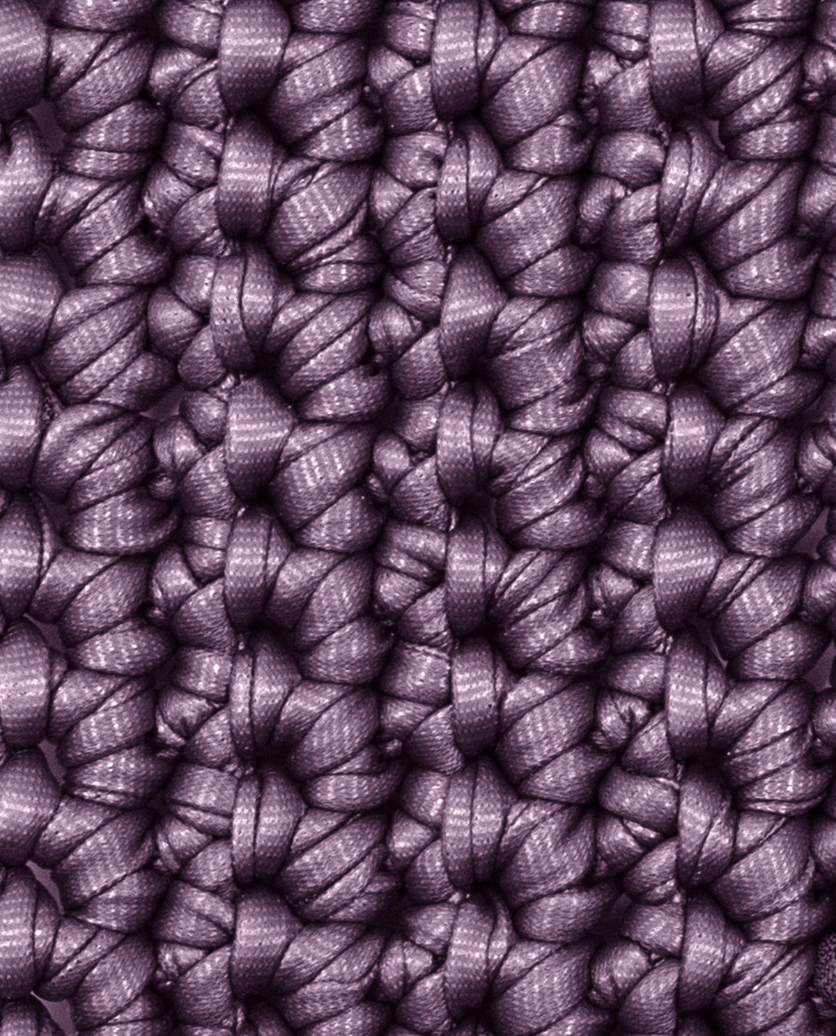 tecido tricotado roxo com textura de nós