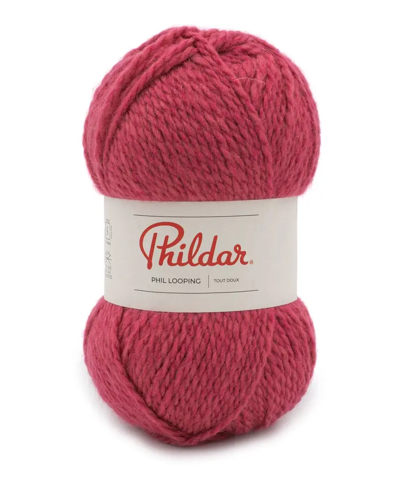 Novelo de lã rosa escuro com etiqueta branca da marca Phildar