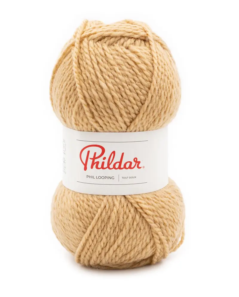 Novelo de lã bege grosso com etiqueta Phildar branca e vermelha