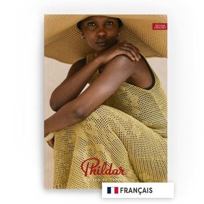 Capa de livro com mulher de vestido de croché amarelo e chapéu largo.