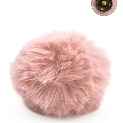 Pomo redondo peludo cor de rosa com fixação metálica dourada.