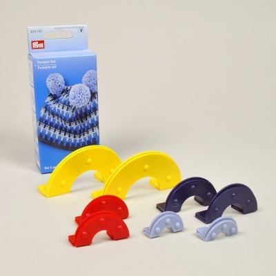 Conjunto de pompons Prym em plástico colorido com caixa azul e imagem de gorro com pompons