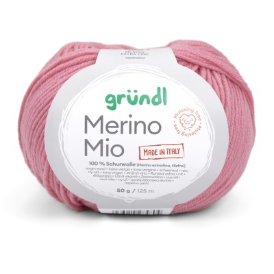 Novelo de lã rosada com etiqueta branca com texto Gründl Merino Mio