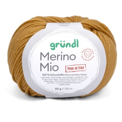 Novelo de lã mostarda com etiqueta gründl Merino Mio e texto detalhado