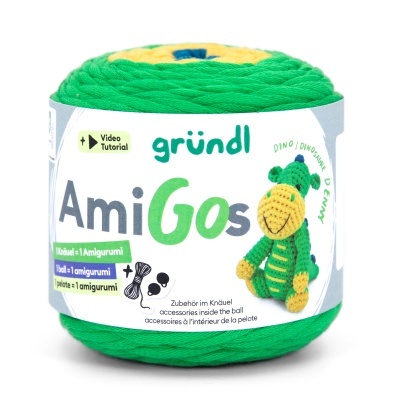 Rolo colorido de fio AmiGos com etiqueta e dinossauro de crochê