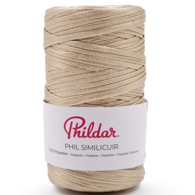 Rolo de fio de poliéster bege da marca Phildar com etiqueta branca