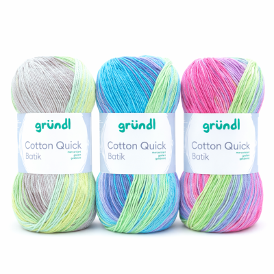 Três novelos de lã multicolorida gründl Cotton Quick Batik