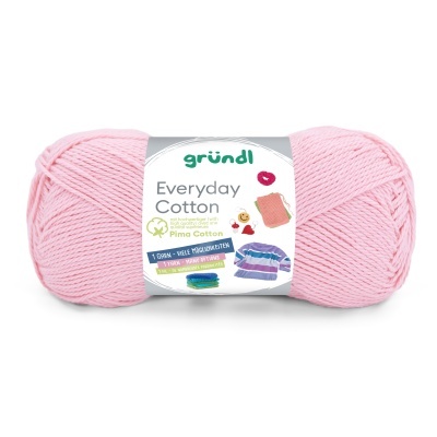 Novelo de fio de algodão cor-de-rosa claro com rótulo branco e texto