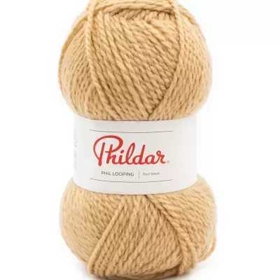 Novelo de lã bege grosso com etiqueta Phildar branca e vermelha