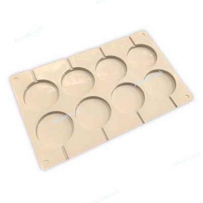Molde de silicone bege com oito cavidades redondas
