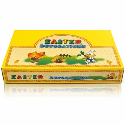 Caixa amarela de papel com texto e desenhos de Páscoa