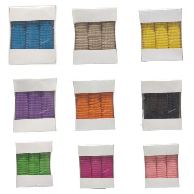 Conjuntos de molas de cabelo coloridas em embalagens brancas