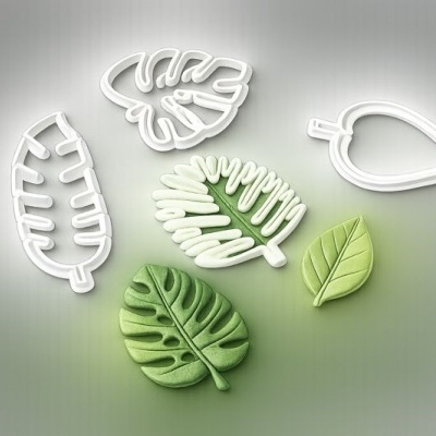 Conjunto de cortadores de folhas e folhas em massa verde
