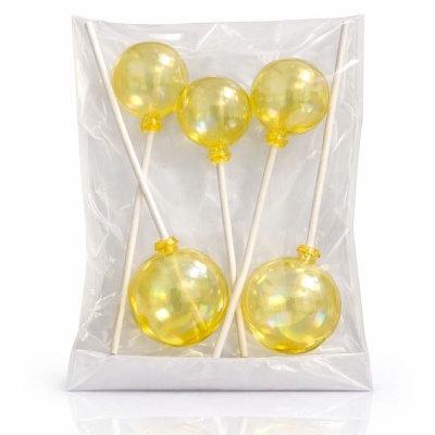 Conjunto de cinco palitos com bolas amarelas brilhantes embalados em saco plástico