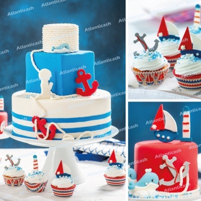 Bolo azul e branco decorado com âncoras e golfinho, e cupcakes com decoração náutica em vermelho, branco e azul