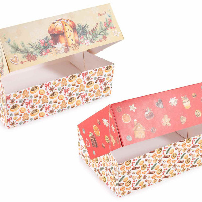 Duas caixas decorativas de papelão com motivos natalícios e tampas coloridas abertas.