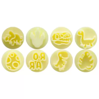 Oito carimbos redondos amarelos e brancos com desenhos de dinossauros e padrões relacionados