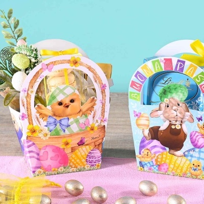 Caixas de presente de Páscoa coloridas com ilustrações de coelhos e laços amarelos