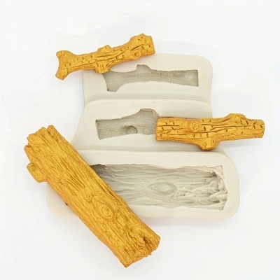 Moldes de silicone para réplicas de madeira e réplicas amarelo-douradas sobre fundo branco