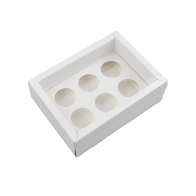 Caixa branca de cartão com divisórias circulares para acondicionar produtos pequenos